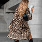 Elegante jurk met V-hals, lange mouwen en print